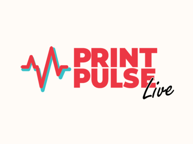 Print Pulse Live A team of professionals in a discussion around a conference table.