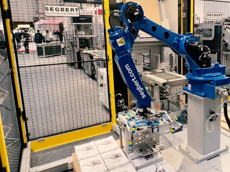 A Segbert GPA25 robot palletizing stacks of magazines.