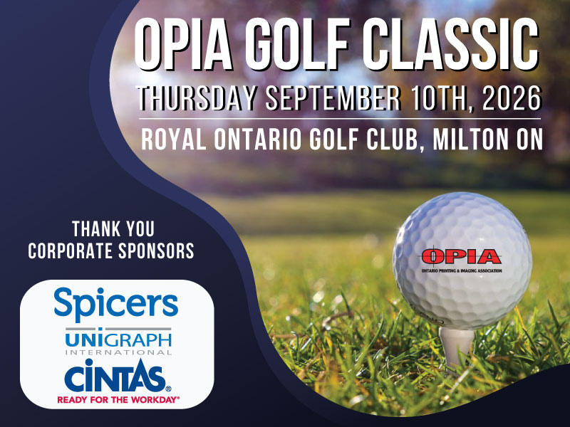 Three professionals of diverse backgrounds engaged in a meeting, discussing documents and digital content at a conference table in a bright office setting.