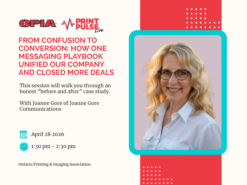 Three professionals of diverse backgrounds engaged in a meeting, discussing documents and digital content at a conference table in a bright office setting.